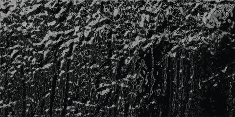 Dark grayscale abstract background with a fluid, dripping texture resembling molten lava or viscous liquid for dramatic and moody visual compositions