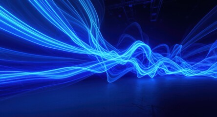 Obraz premium Blue flowing energy, with luminous trails against a dark backdrop