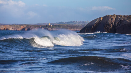  Waves in the Cantabrian Sea, in the background of the Aviles lighthouse. Asturias
