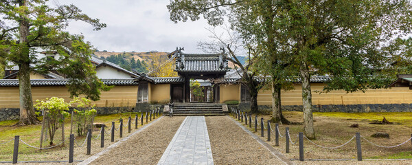 Entrance and surrounding wall of small temple in Todai-ji temple area in Nara, Honshu island in Japan