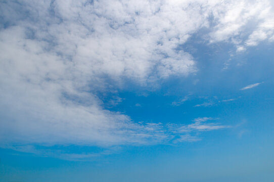 Bright Blue Sky Background with White Cirrocumulus and Stratus Clouds - Powered by Adobe
