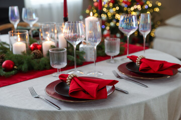 Festive table setting with Christmas decor indoors, closeup