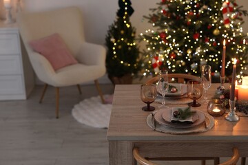 Festive table setting with Christmas decor indoors. Space for text