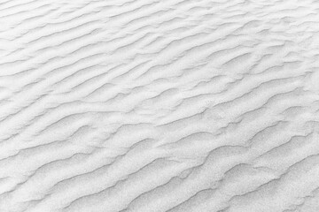 closeup of sand pattern of a beach in the summer