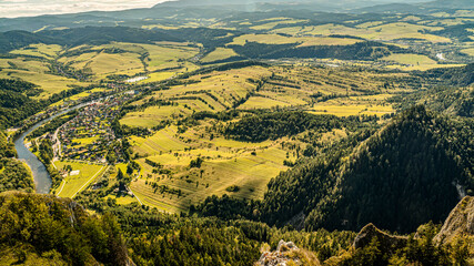 Panoramic Mountain View Over Dunajec River Valley With Lush Forest, Sunny Sky, and Rolling Hills