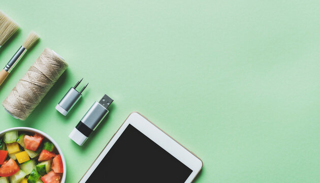 Creative workspace with art supplies, tech gadgets, and healthy salad for modern lifestyle inspiration - Powered by Adobe