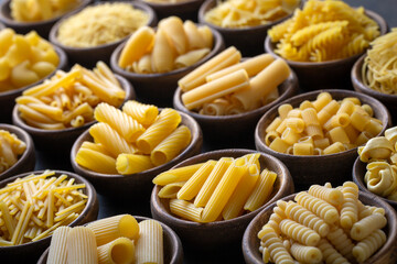 Composition with different tasty uncooked pasta - Italian pasta wallpaper, different types and shapes of pasta layout