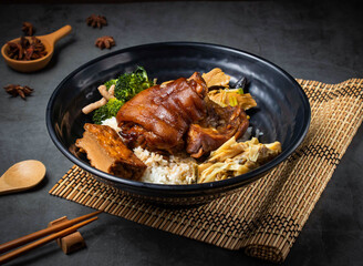 Braised pork Trotter hock meal. This comforting, healthy dish features tender pork, fluffy rice, and vibrant greens for a tasty culinary experience.
