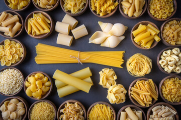 Composition with different tasty uncooked pasta - Italian pasta wallpaper, different types and shapes of pasta layout
