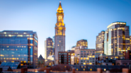 Boston in Massachusetts, USA at night in a conceptual blurred image of its skyscrapers.