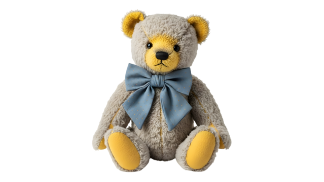 Fluffy grey teddy bear with yellow accents and a blue bow tie isolated on a transparent background stuffed animal - Powered by Adobe