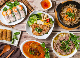 Vietnamese cuisine feast enticing diverse tastes with fresh spring rolls and flavorful noodle soups on rustic wooden table