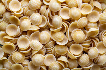 Close up of uncooked orecchiette pasta background