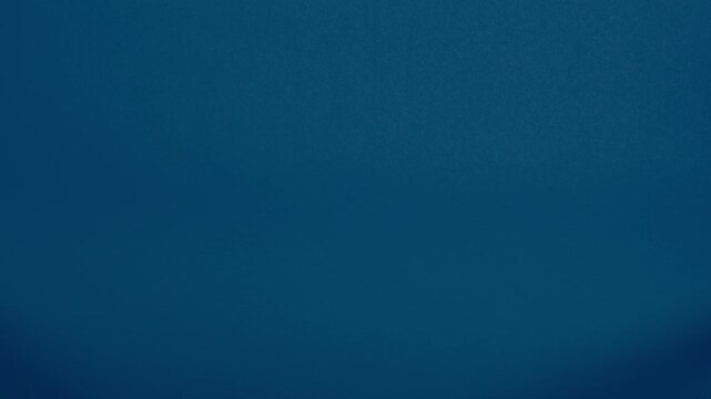 Cereals on a blue background. Forming a grid pattern out of the golden loops in lines and rows. Abstract food transition footage.