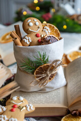 On the table there is New Year's tea 2026, coffee, gingerbread and pine cone cookies.