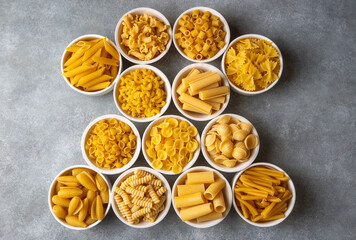 Composition with different tasty uncooked pasta - Italian pasta wallpaper, different types and shapes of pasta layout