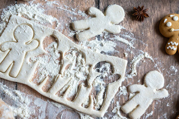 On the table there is New Year's tea 2026, coffee, gingerbread and pine cone cookies.