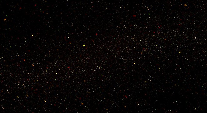 Abstract golden glittering particles on a dark backdrop creating a magical atmosphere