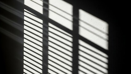 Shadows of window blinds create a geometric pattern on a wall.
