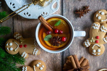 On the table there is New Year's tea 2026, coffee, gingerbread and pine cone cookies.