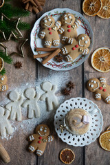 On the table there is New Year's tea 2026, coffee, gingerbread and pine cone cookies.