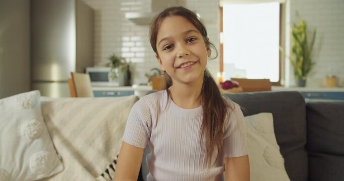 Selfassured female demonstrating kindness in stylish modern house