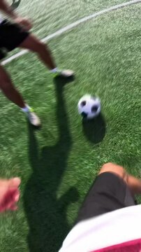 First person perspective of a male soccer player running, kicking the ball, and scoring a penalty goal, finishing with a happy selfie