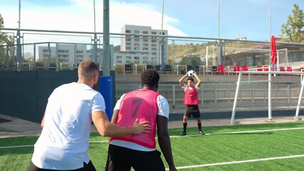 Professional soccer coach giving instructions to a young athlete during a practice session. The player receives a throw in and dribbles past obstacles - Powered by Adobe
