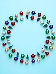 Bright balls and mini trees on blue background