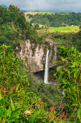 Waterfall in the middle of a canyon in the Colombian Andes. With lush vegetation and vivid colors of real nature. Los Molinos waterfall, Villamar&iacute;a Caldas