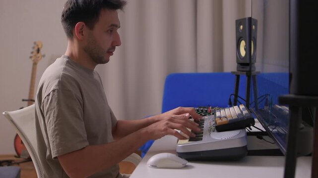 Music producer manipulates faders and displays in dimly lit home studio, Creative audio engineer calibrates channel strips and meters during detailed mixing session