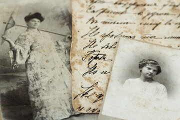 Vintage portraits of woman and girl. Part of a letter on the back of a old photo during the 1917 revolution:
"Proudly stand...
Save in your soul....
Don't call fate....."
Further illegible