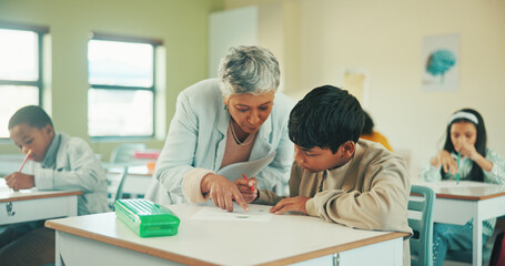 Obraz premium Studying, teacher and question with boy in classroom for student opinion, quiz discussion and attention. Course guidance, help and problem solving solution with children in school for lesson