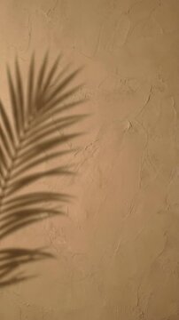 Vertical seamless loop of a tropical palm leaf shadow swaying gently on a white textured wall, creating a relaxing minimalist background for social media stories.