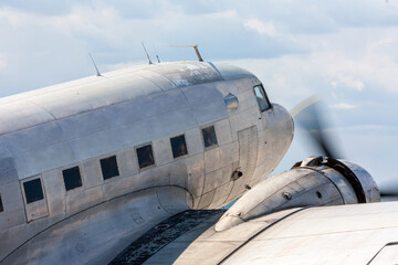 Close-up oldtimer piston-engined passenger aircraft at the airport