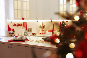 Christmas decor and tableware on countertop in kitchen. Interior design