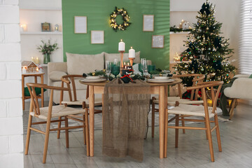Festive table setting with Christmas decor indoors