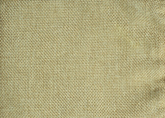 Close-up of light brown canvas textured background.