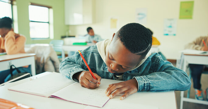 Classroom, child and writing notes in book for learning, maths lesson and practice sums for education. Calculation solution, kids or boy with problem solving in school, concentration or study numbers