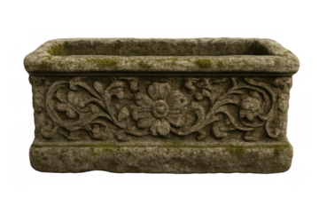 Stone garden planter box with intricate floral carving and weathered moss texture, antique trough for outdoor plants