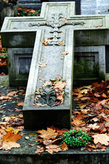 Ancient Stone Cross in Autumn Cemetery