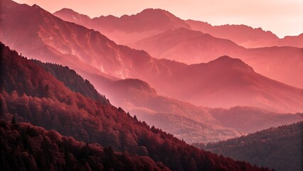 Layers of mountain ranges at sunset with pink and orange hues