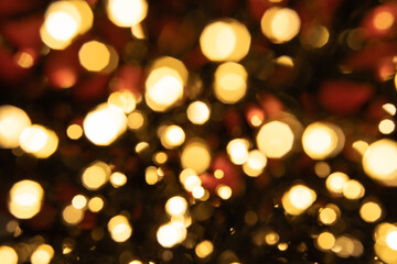 Softly blurred Christmas lights create a dreamy bokeh effect against a rich red background, producing the perfect atmospheric backdrop for holiday advertising, greeting cards, and digital designs.