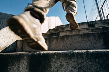 A person is running up a set of stairs