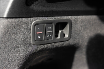 Button for extending and retractable towbar. Deployable Electric Tow Bar buttons. Buttons in the trunk for extending the towbar. Car tow hitch button or opening system. Foldable tow device switch