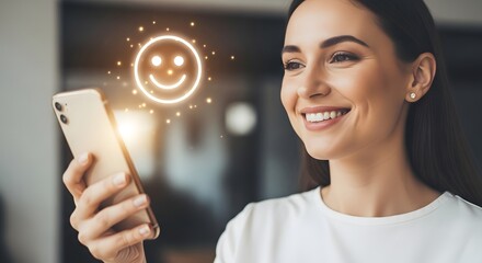 Woman Smiling While Holding Smartphone with Happy Face Icon.