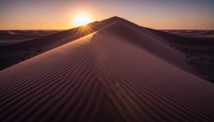 Vast rippled sand dunes with sharp crests glow in the warm golden light of a beautiful sunset, creating a serene and majestic desert landscape with long shadows and a sunburst