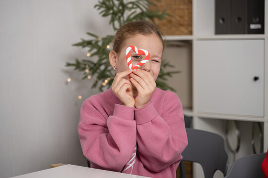 Child making Christmas crafts with plasticine