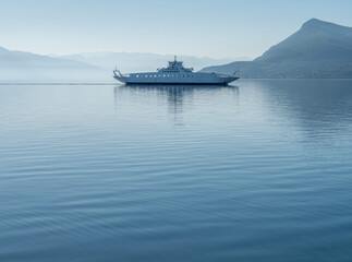 Obraz premium Passenger ferry in the calm Aegean Sea in Greece in a minimalist style