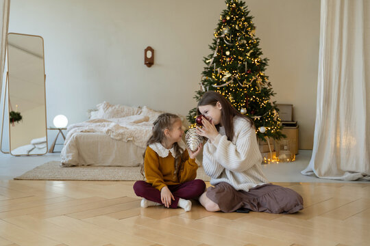 Sisters sharing a joyful Christmas moment